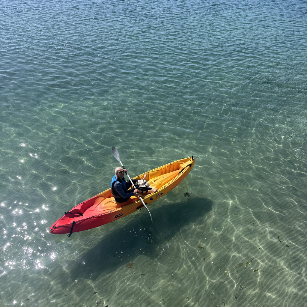 Kayaker on clear waters of Kilmurvey Bay, Inishmore, Aran Island