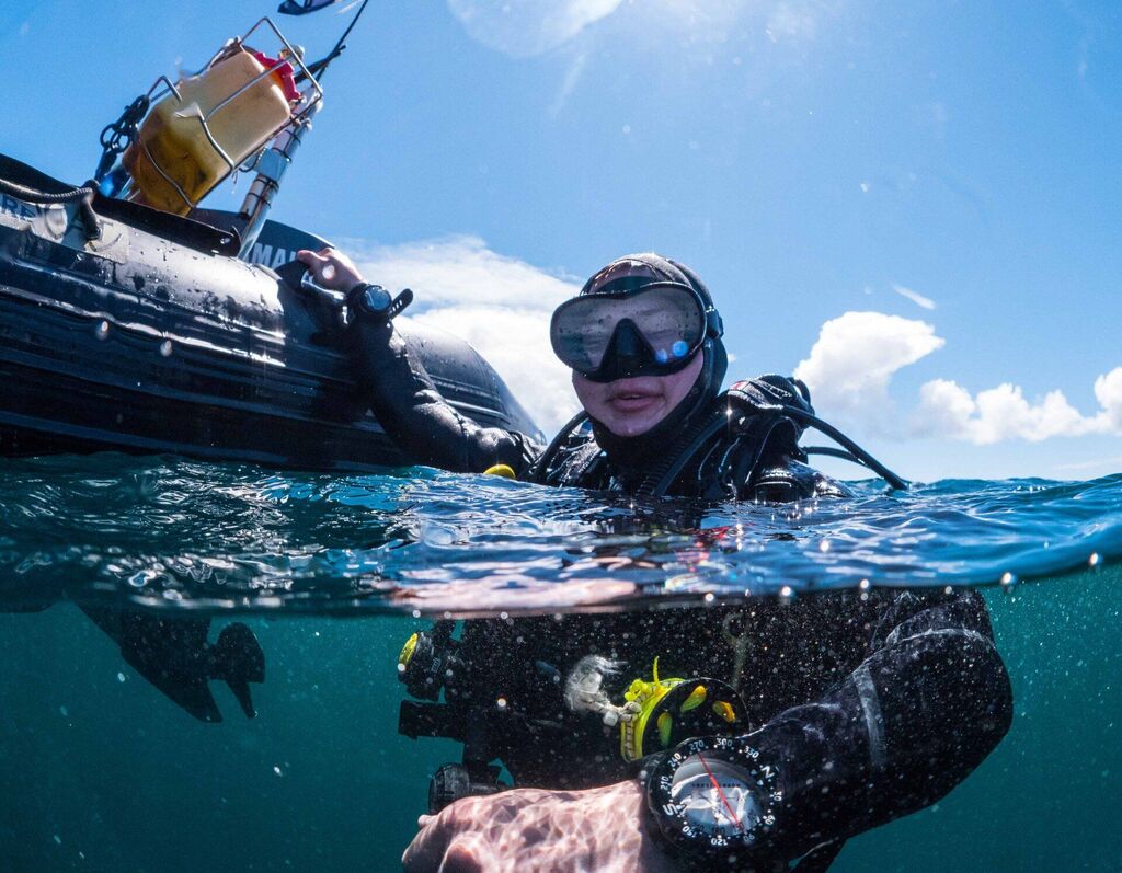 Happy scuba diver in the water ready to go scuba diving near Aran Islands